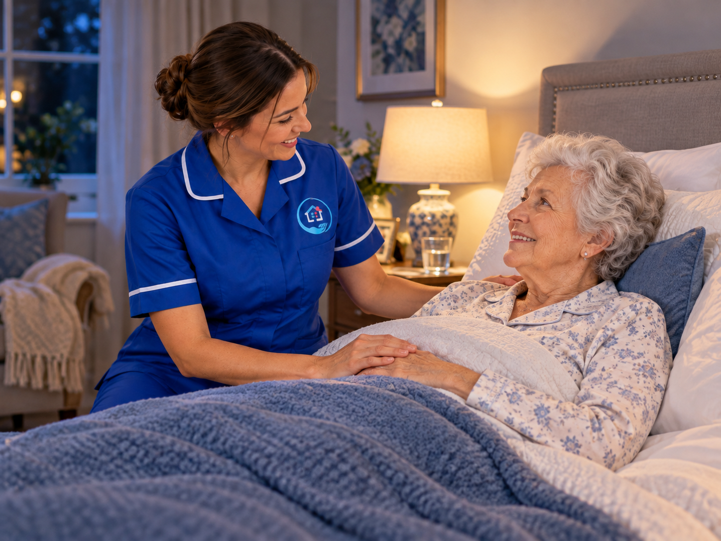 Carer and an older woman together in her kitchen at home